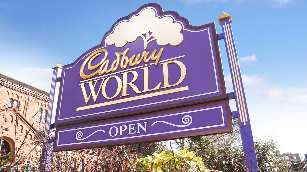 Cadbury World entrance sign with "Open" displayed, Birmingham, UK.