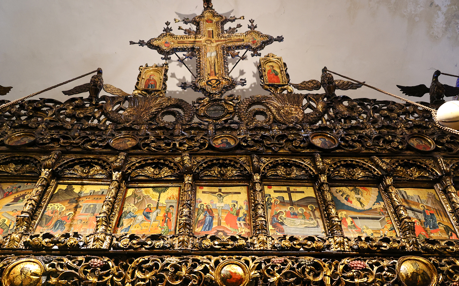 Iconography inside Onufri National Iconographic Museum, Berat, featuring ornate religious paintings and carvings.