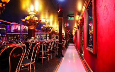 Dining area with elegant chandeliers at Señor Tango Show, Buenos Aires.