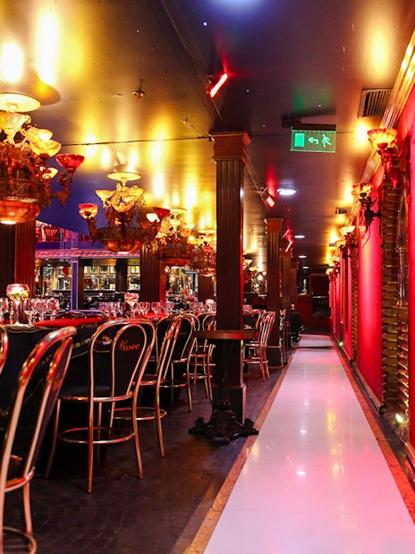 Dining area with elegant chandeliers at Señor Tango Show, Buenos Aires.