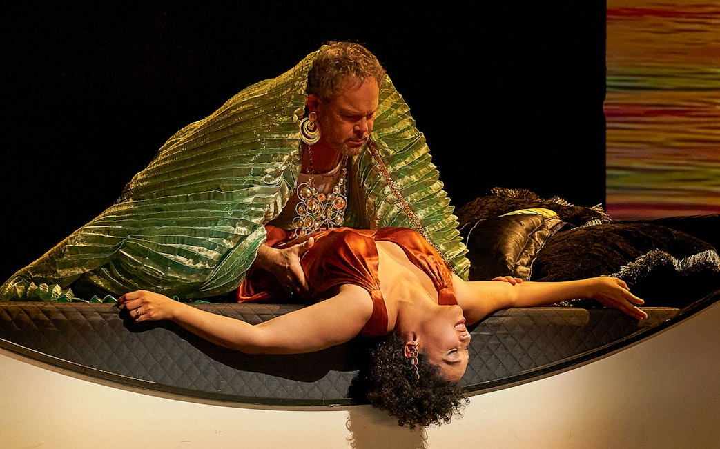 Antony and Cleopatra in dramatic scene on stage.
