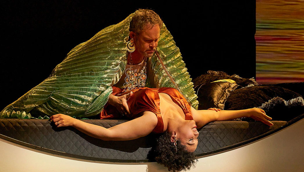 Antony and Cleopatra in dramatic scene on stage.