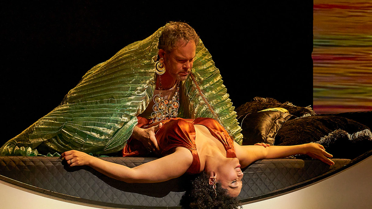 Antony and Cleopatra in dramatic scene on stage.