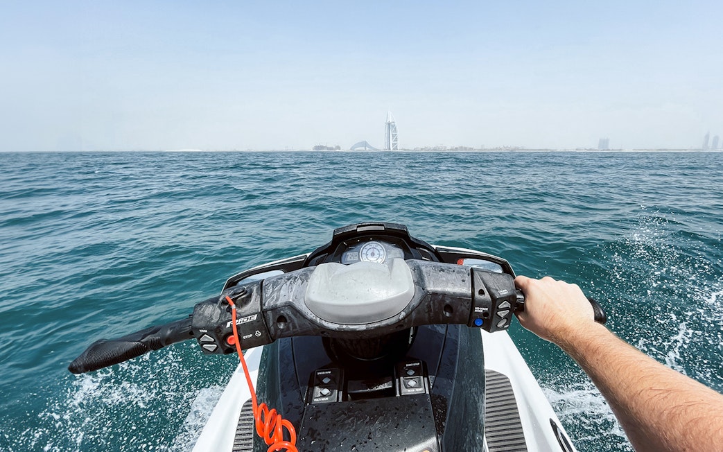 Jet ski ride with view of Burj Al Arab in Dubai.