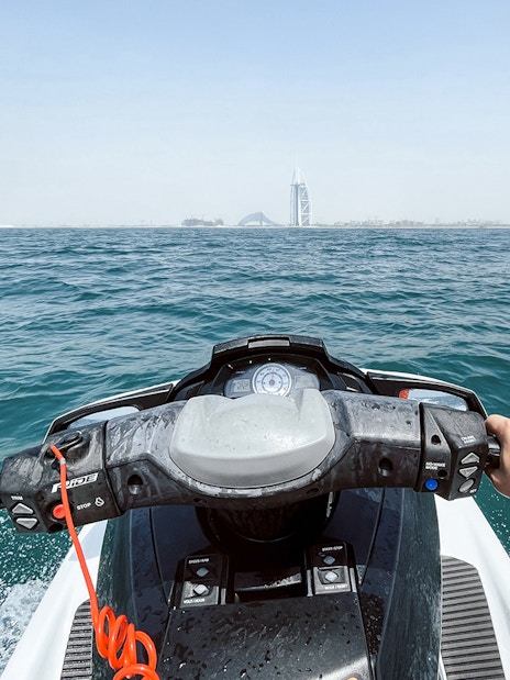 Jet ski ride with view of Burj Al Arab in Dubai.