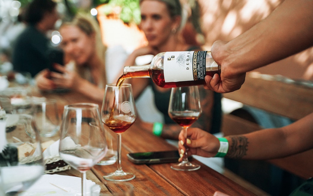 Wine being poured into a glass during Krka Waterfalls tour from Split.