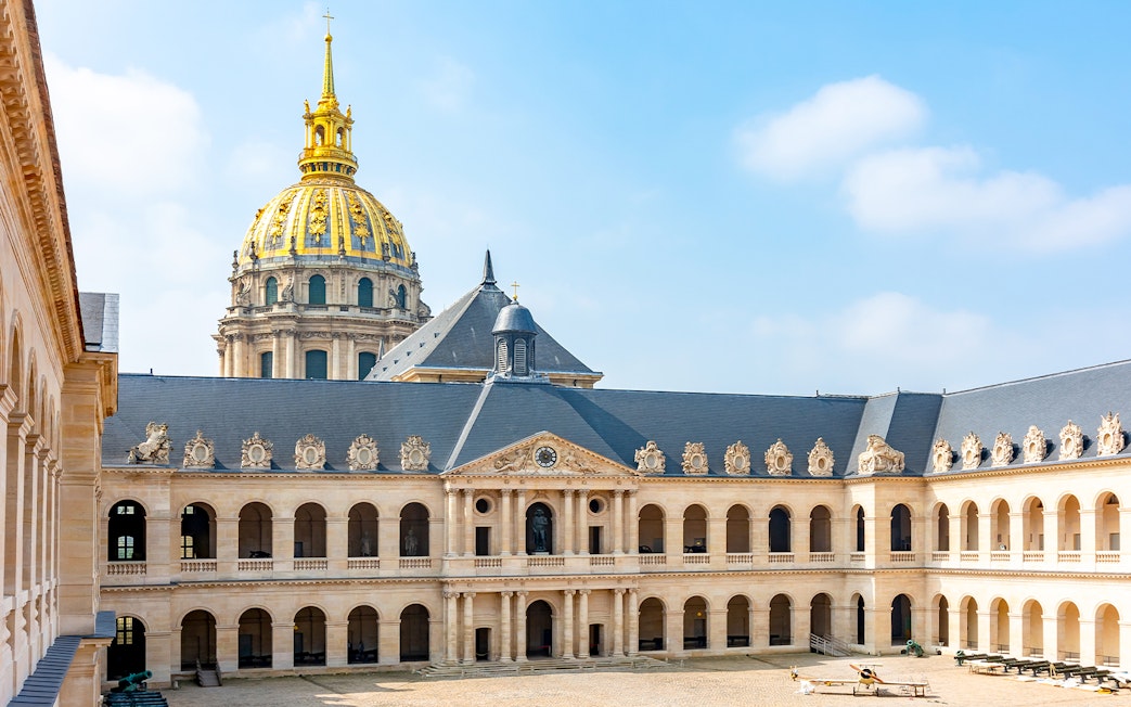 Courtyard of Les Invalides with view of the golden dome, Paris, France.