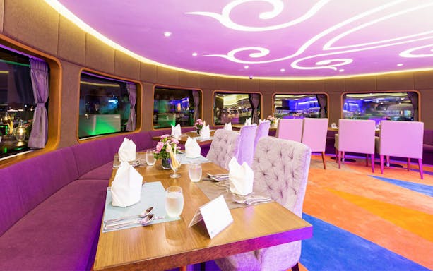 Elegant dining setup on Wonderful Pearl Candle Light Dinner Cruise.