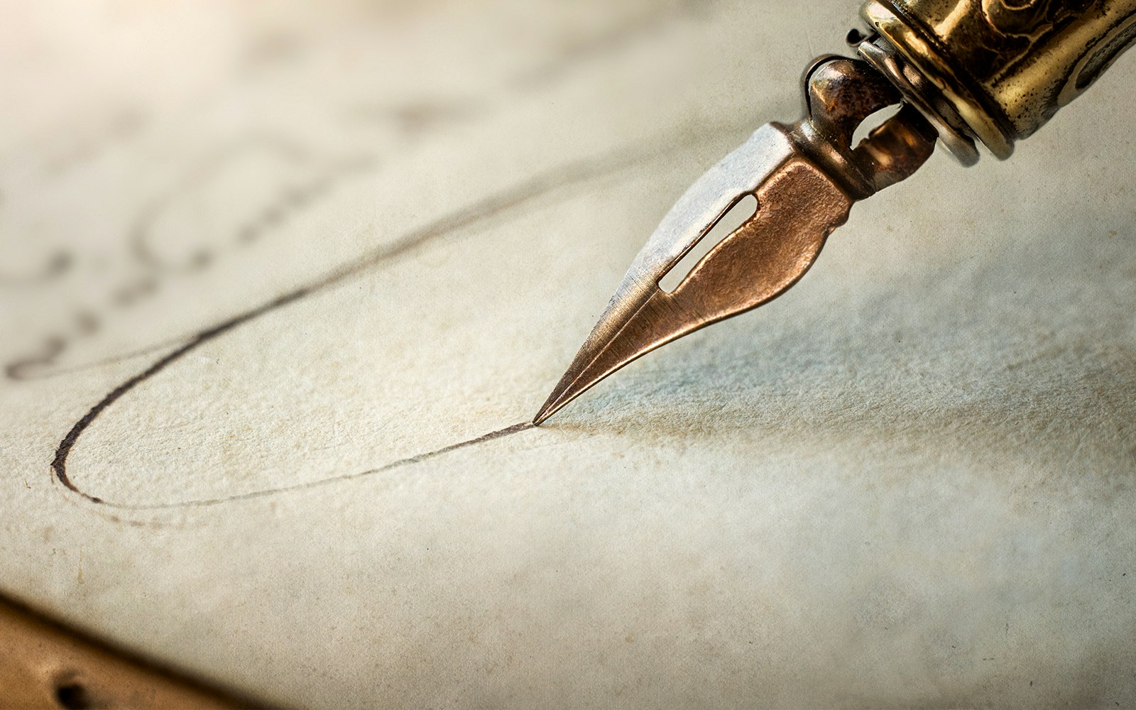 Fountain pen writing on an antique handwritten letter.