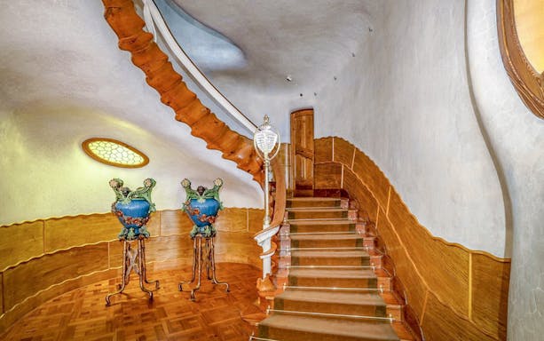 Staircase with ornate vases in Casa Batlló, Barcelona.