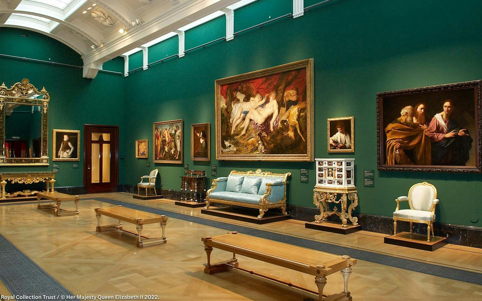 Artworks and ornate furniture inside the Queen's Gallery at Buckingham Palace.