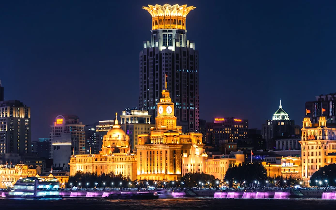 Night view of The Bund's historic European-style buildings along the Huangpu River in Shanghai, China.
