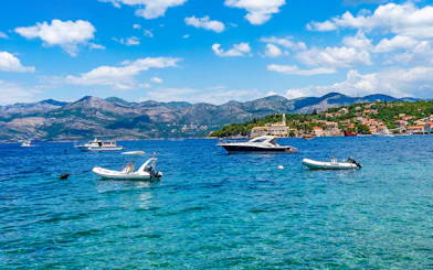 Boats on the water near Elaphiti Island Lopud with Dubrovnik in the background.