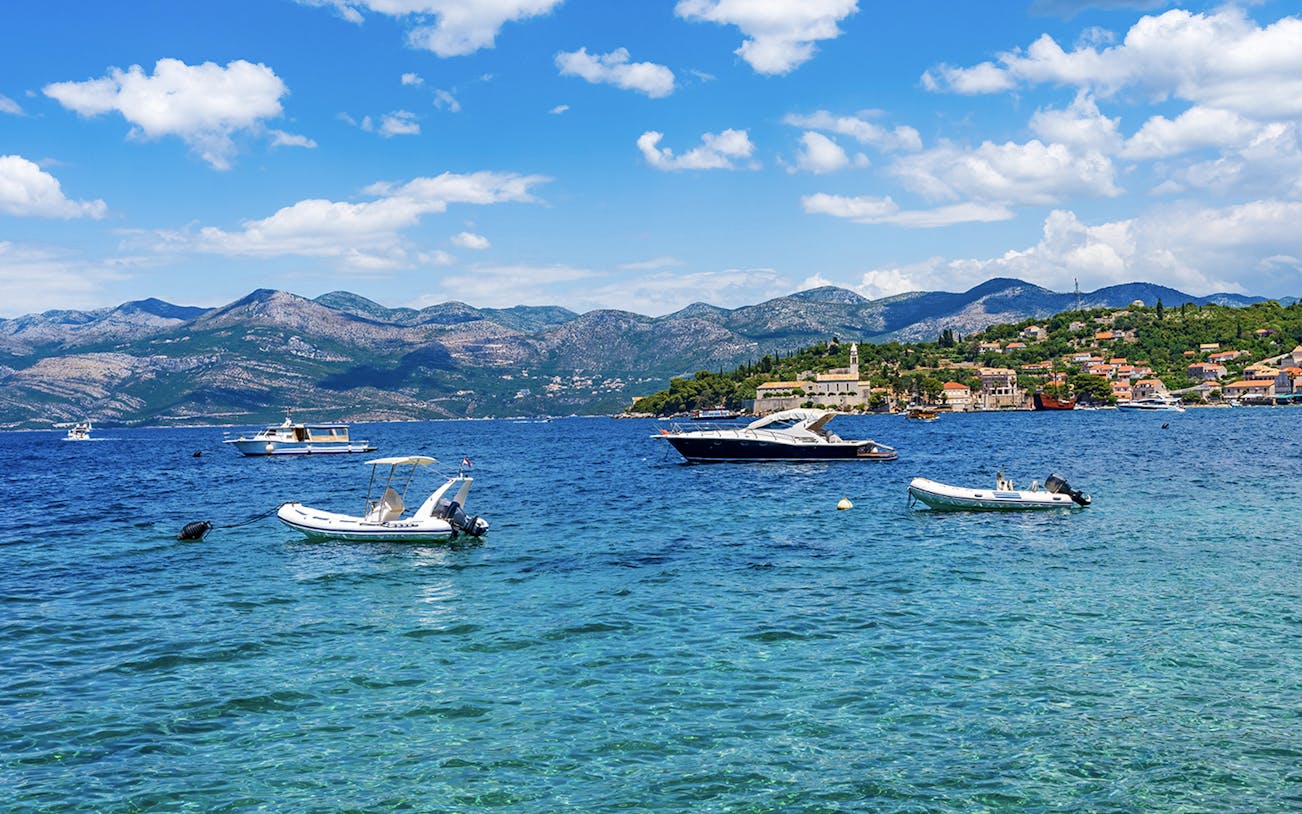 Boats surrounding Elaphiti Island Lopud near Dubrovnik, showcasing coastal scenery.