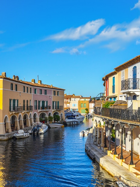 Colorful houses and boats along a canal in Port Grimaud, France.