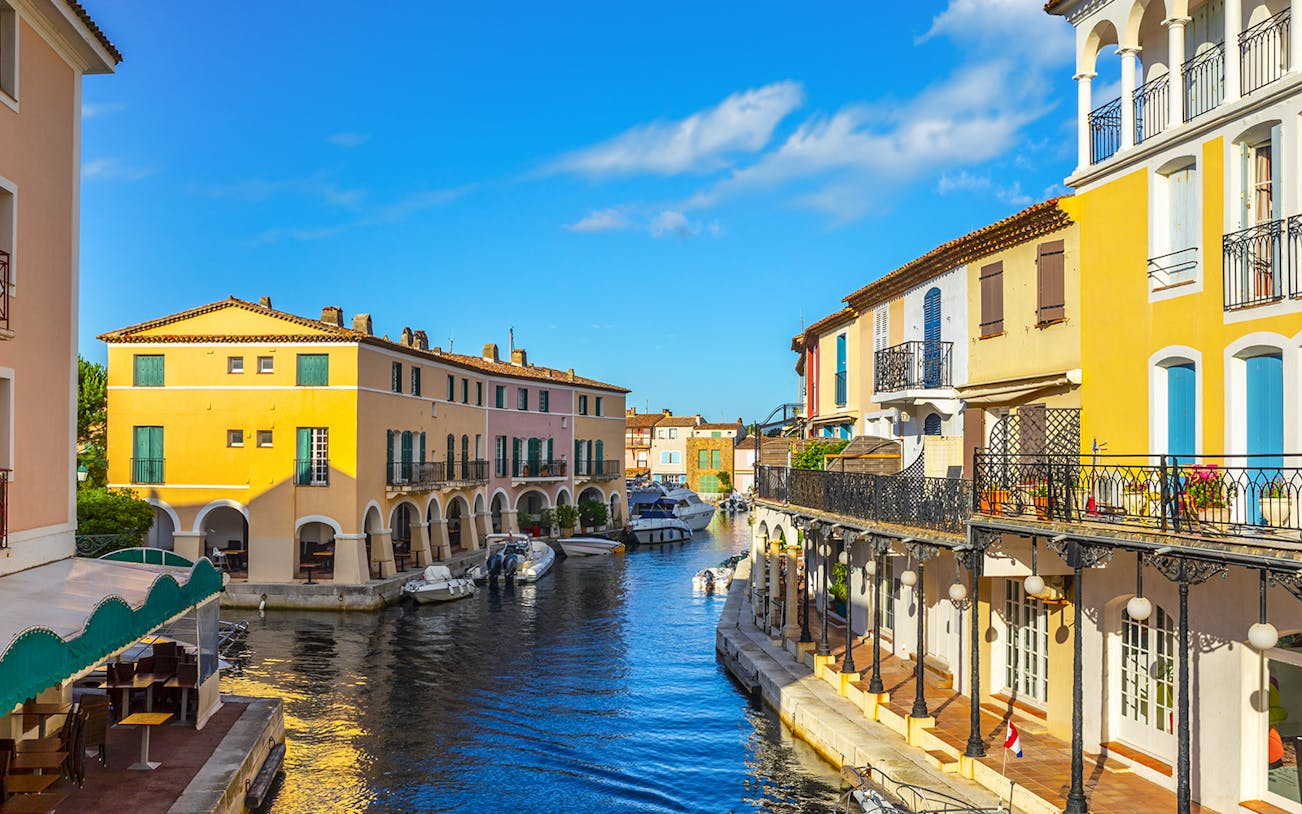 Colorful houses and boats along a canal in Port Grimaud, France.