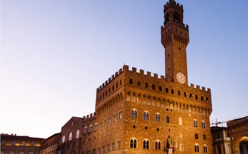 Palazzo Vecchio at dusk in Florence, part of the Haunted Florence exploration game.