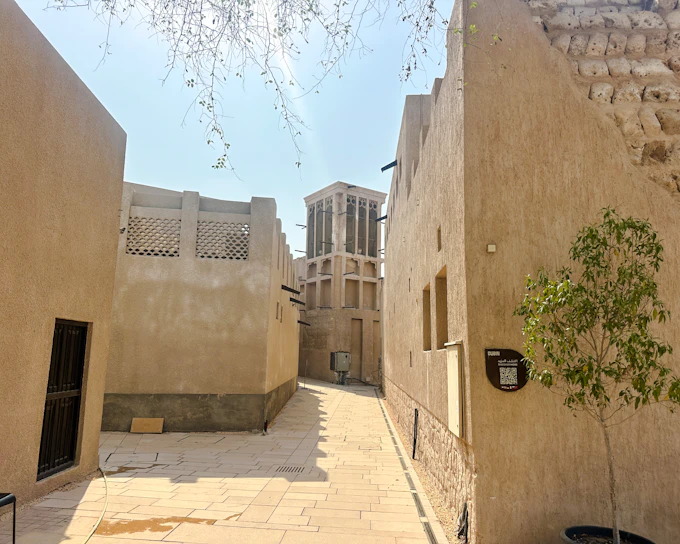 Dubai Al Fahidi Old Town Walking Tour with Abra Ride and Spice and Gold Souks