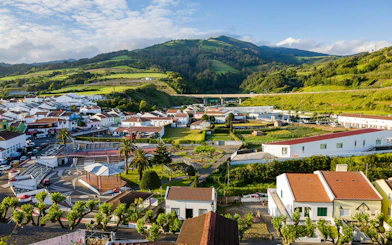 Aerial view of Agua De Pau village with lush green hills in Sao Miguel Island, Azores.