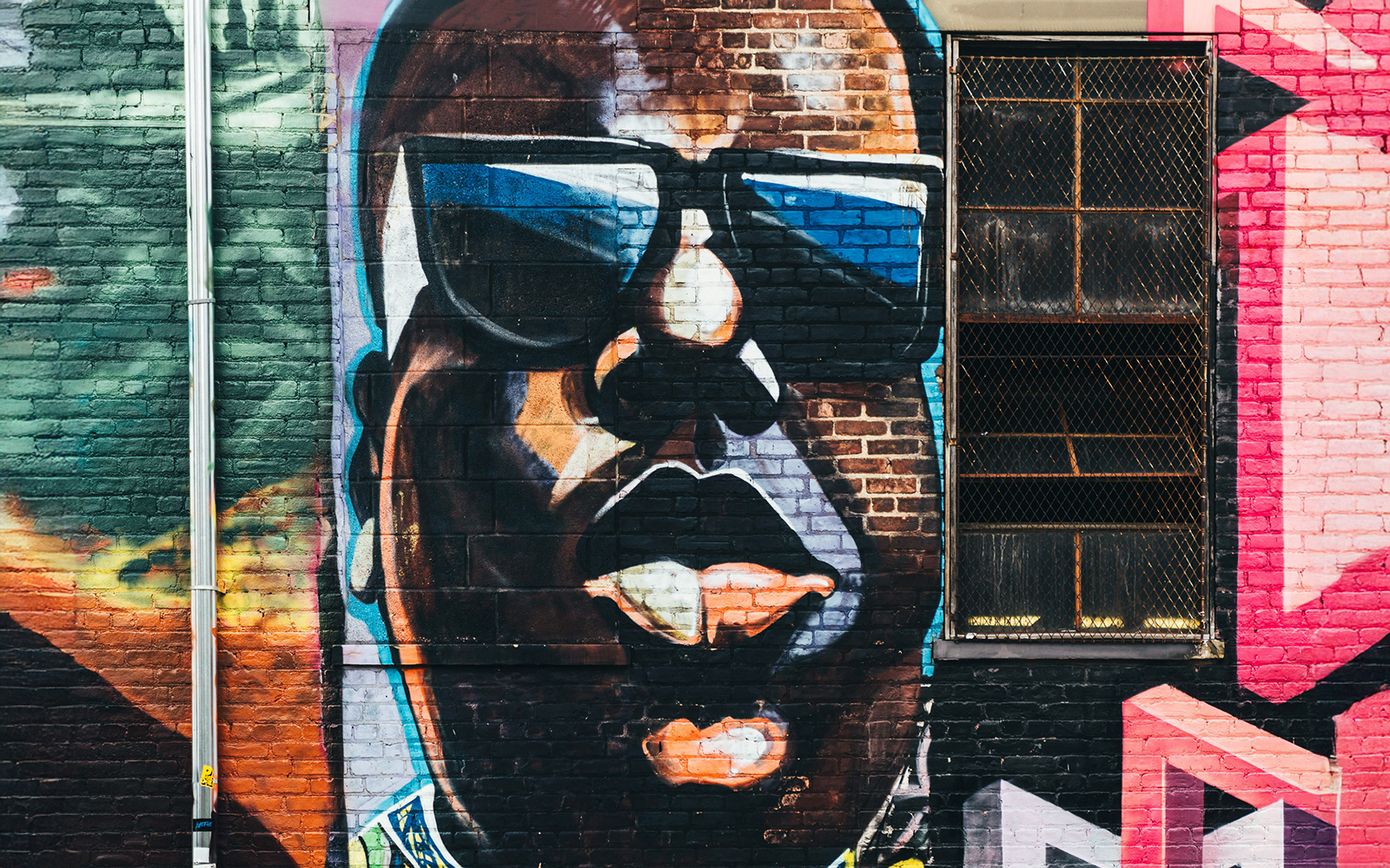 Bushwick New York vibrant street art mural featuring colorful abstract designs.