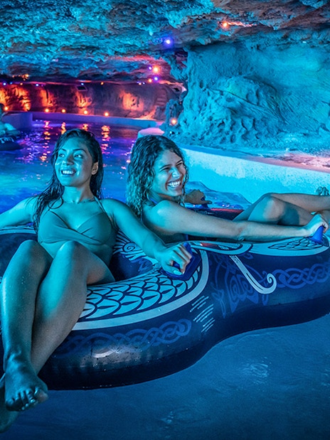 Visitors enjoying a lazy river ride at Rulantica water park.