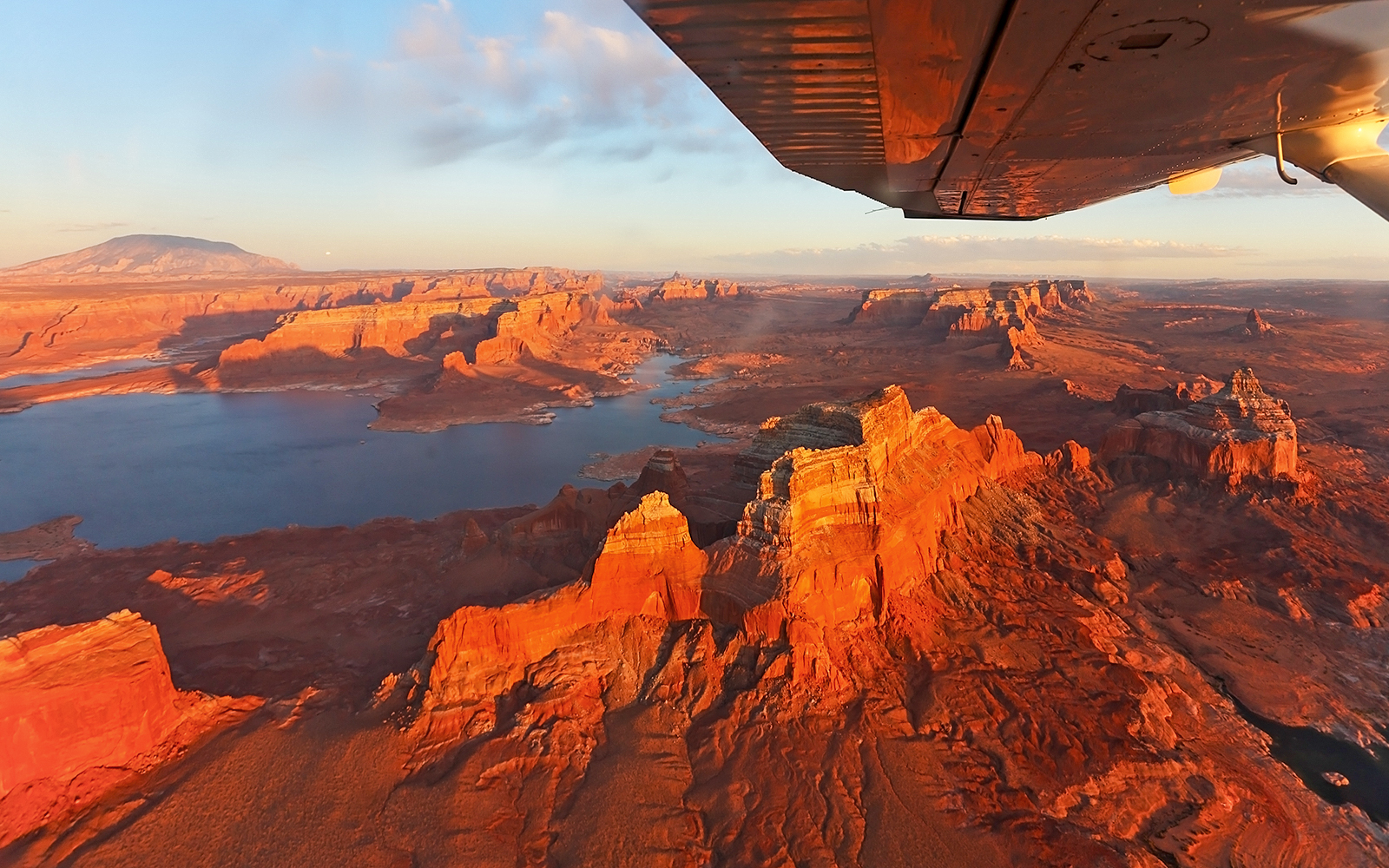 Aerial view of Antelope Canyon and Horseshoe Bend from an airplane during a scenic tour.