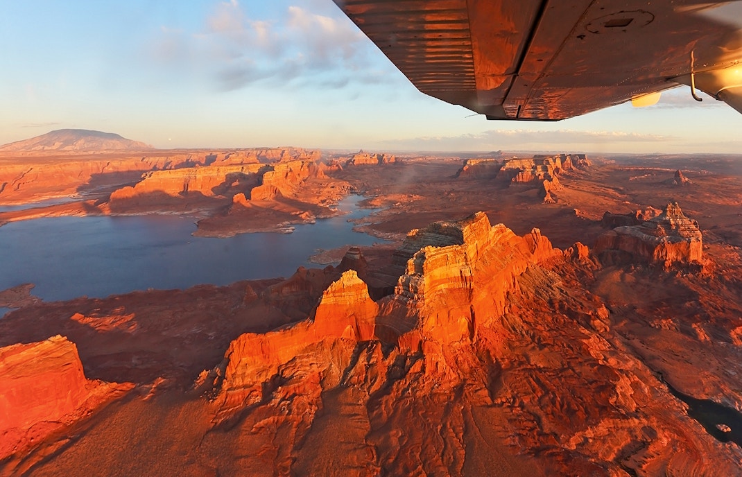 Airplane flying over the breathtaking Antelope Canyon & Horseshoe Bend, offering a unique aerial view of these iconic landmarks during the tour