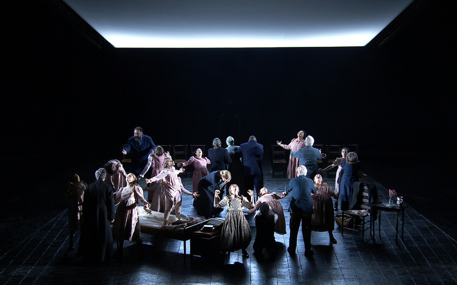 Stage performance of "The Crucible" with actors in period costumes, dramatic scene.