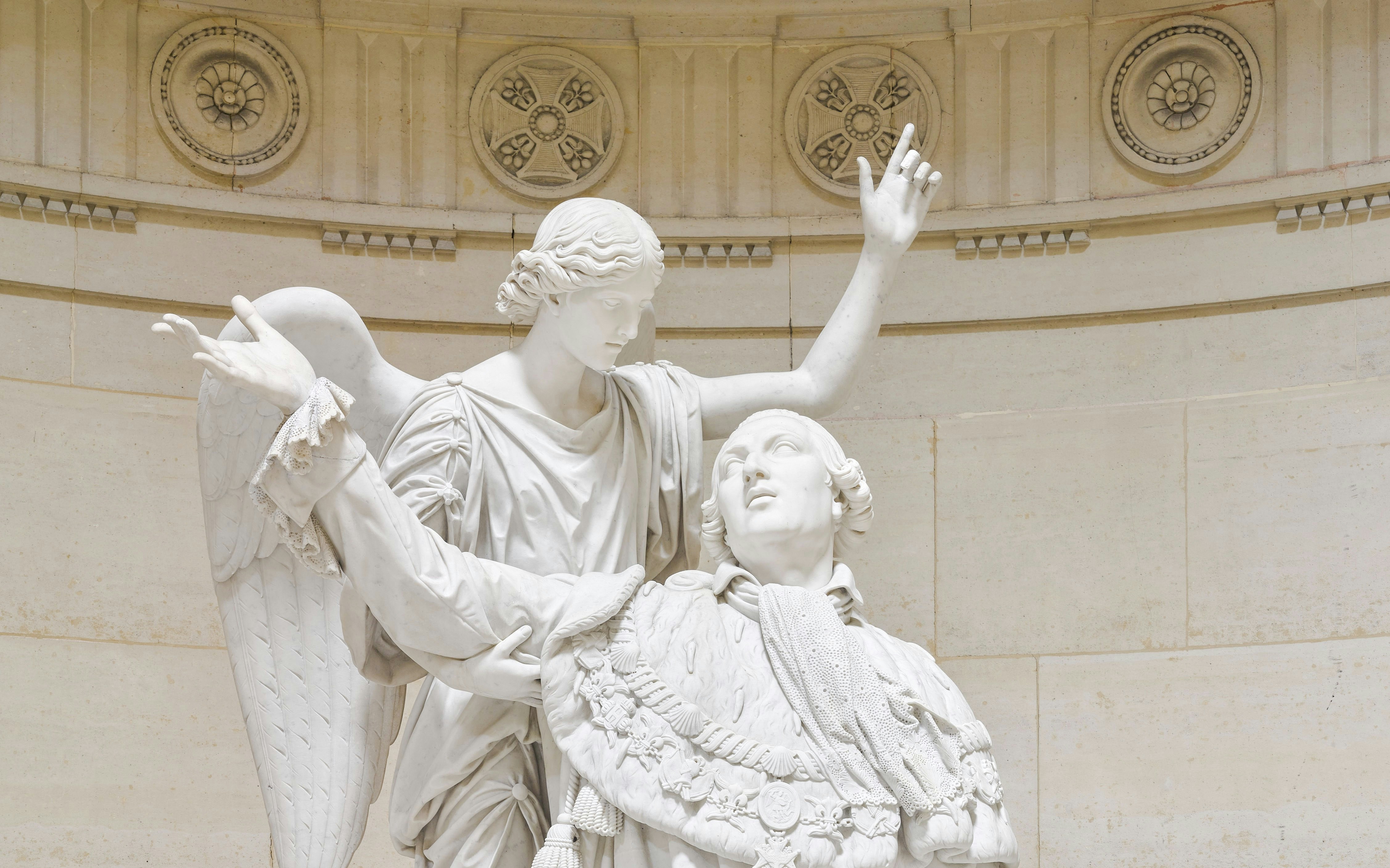 Statue of angel and figure in Expiatory Chapel, Paris.