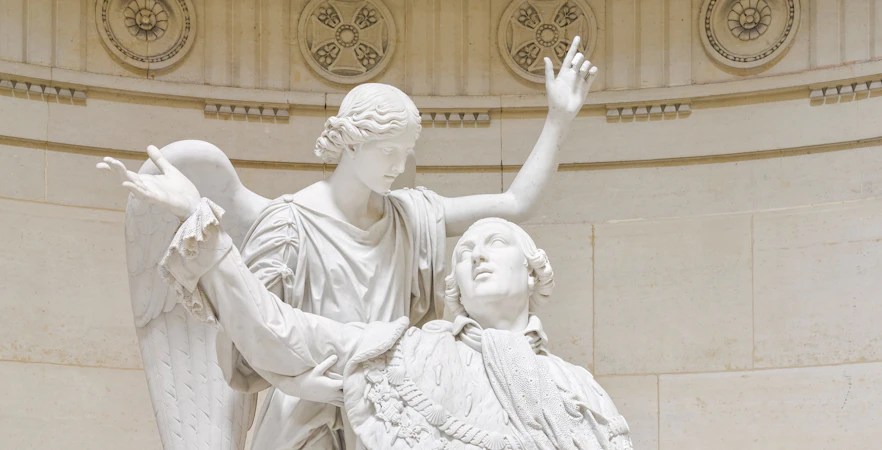 Statue of angel and figure in Expiatory Chapel, Paris.