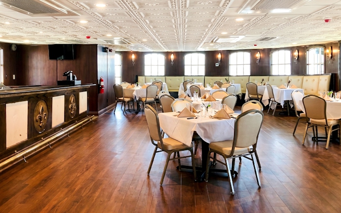 Elegant dining area set for brunch on the Riverboat City of New Orleans cruise.