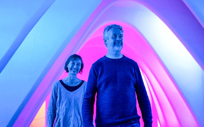 Visitors enjoying Casa Batlló's illuminated arches during a winter night tour.