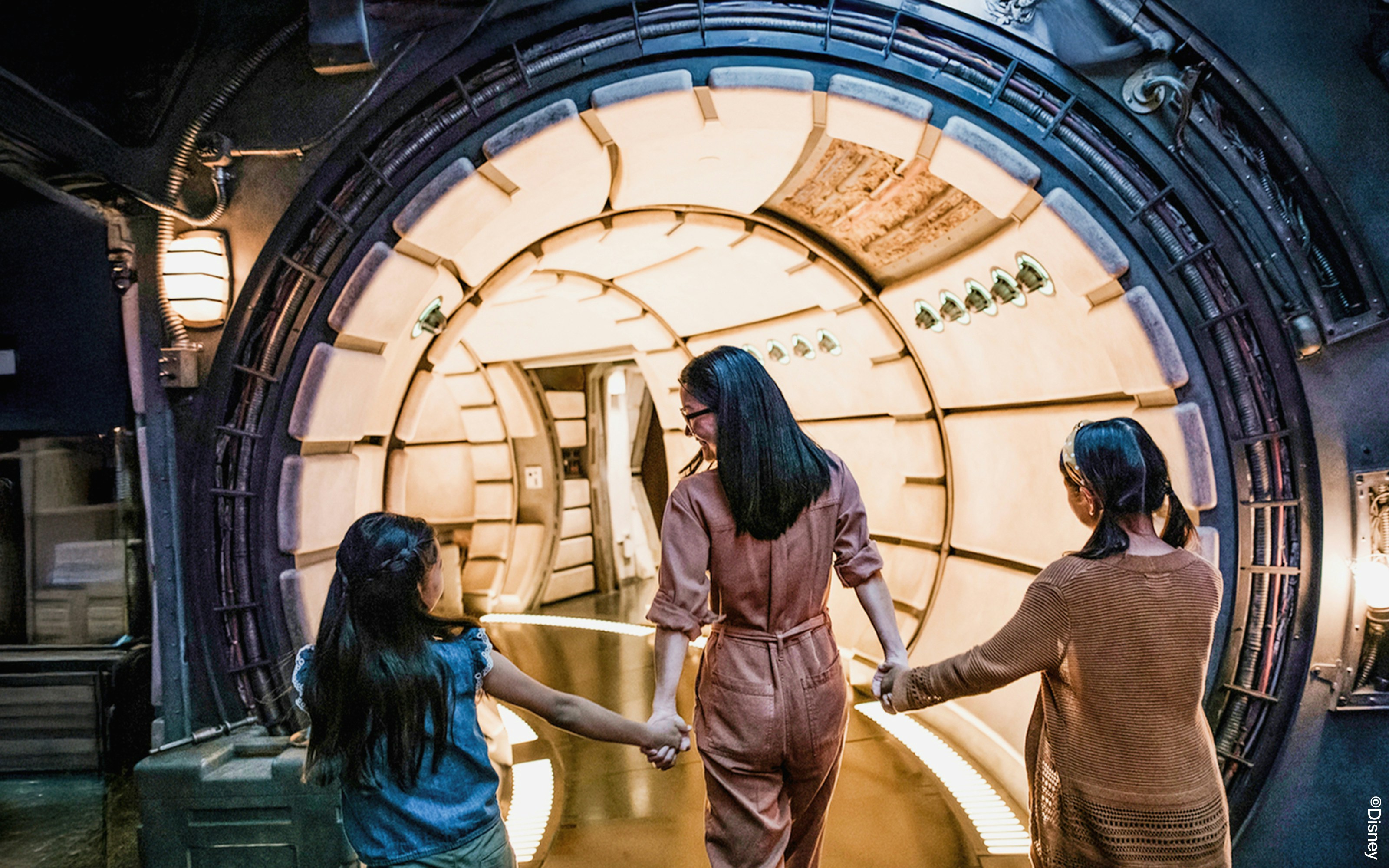 Guests entering Star Wars-themed tunnel at Disneyland Adventure Park, California.
