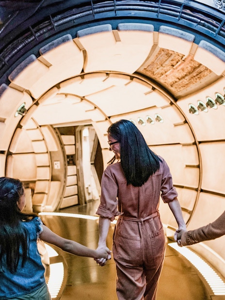 Guests entering Star Wars-themed tunnel at Disneyland Adventure Park, California.