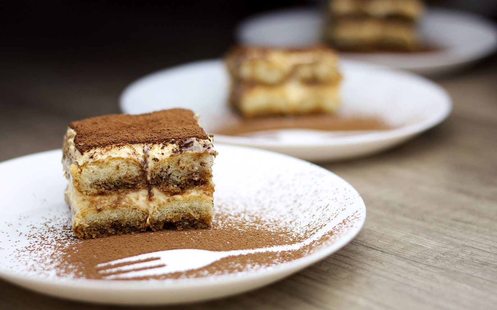 Tiramisu dessert served on a plate at Opera Arias Concert & Pizza Dinner in Florence.