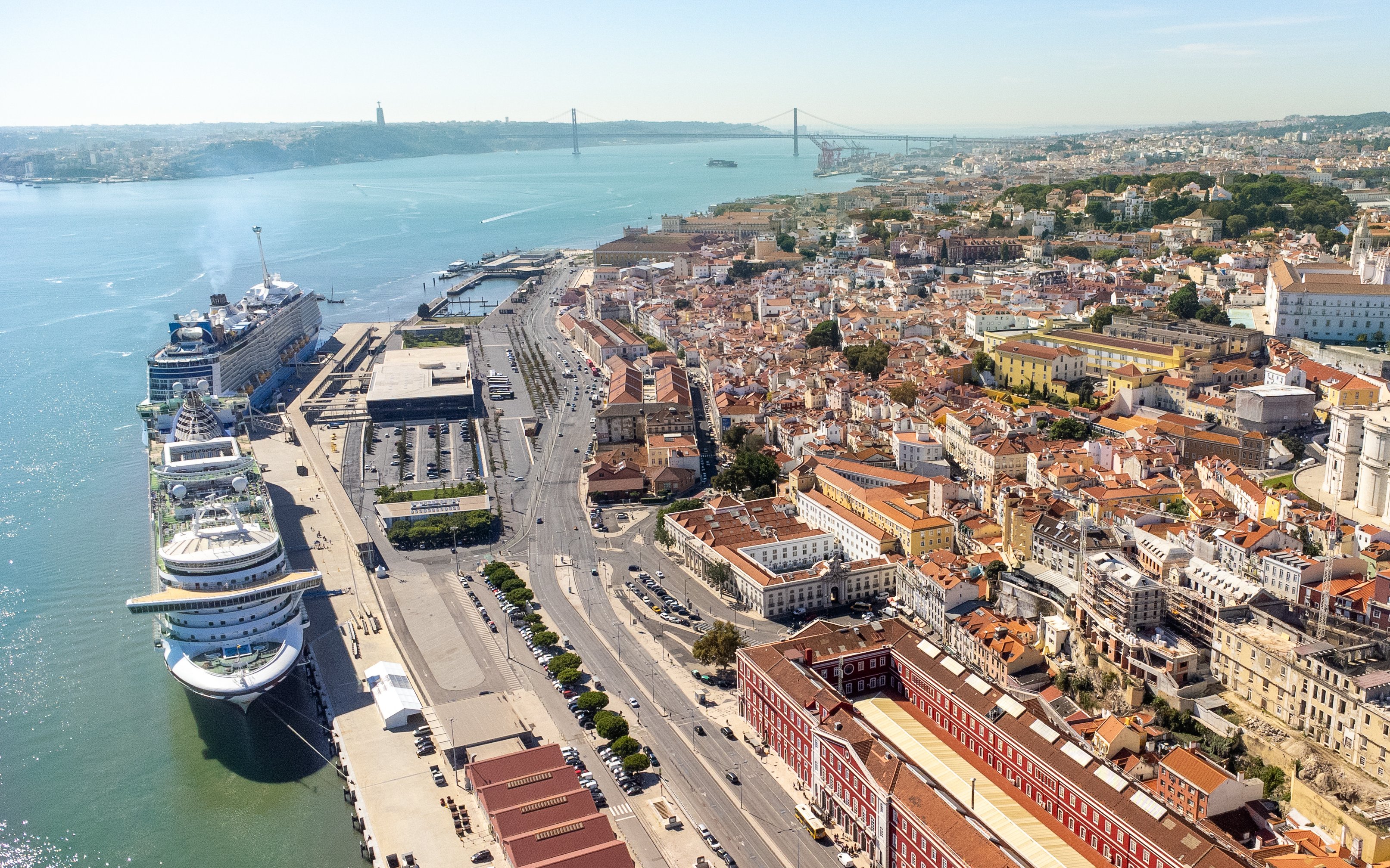 Aerial view of Lisbon city center with cruise ships docked at Lisbon port.