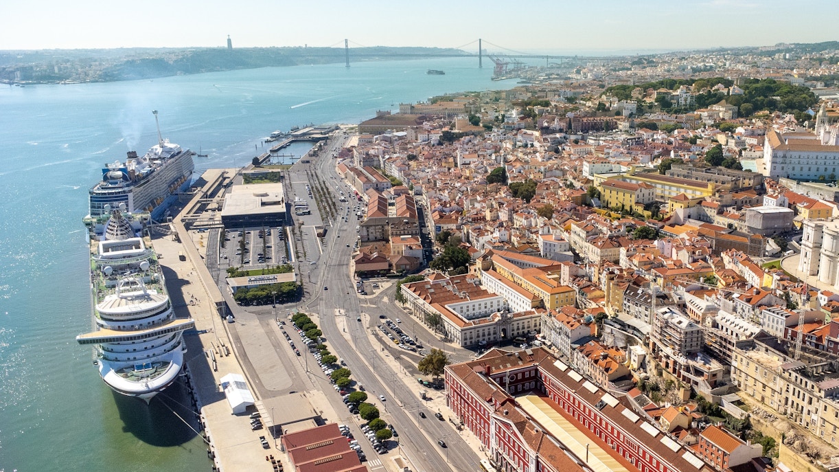 Aerial view of Lisbon city center with cruise ships docked at Lisbon port.