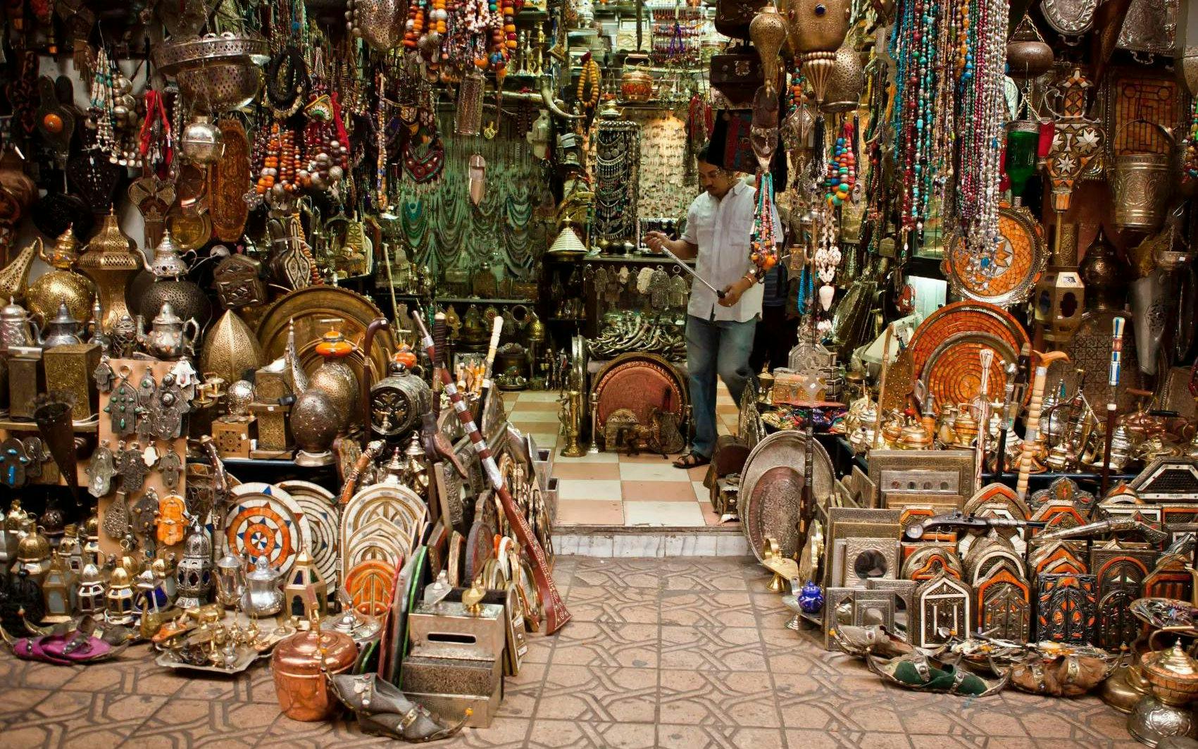 Fes Old Medina market stall with traditional Moroccan crafts and antiques.
