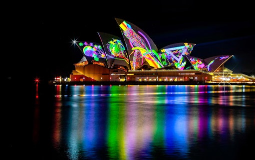 Sydney Opera House illuminated during Vivid Dinner & Drinks Cruises.
