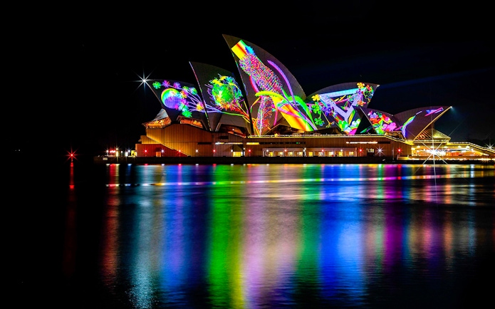 Sydney Opera House illuminated during Vivid Dinner & Drinks Cruises.