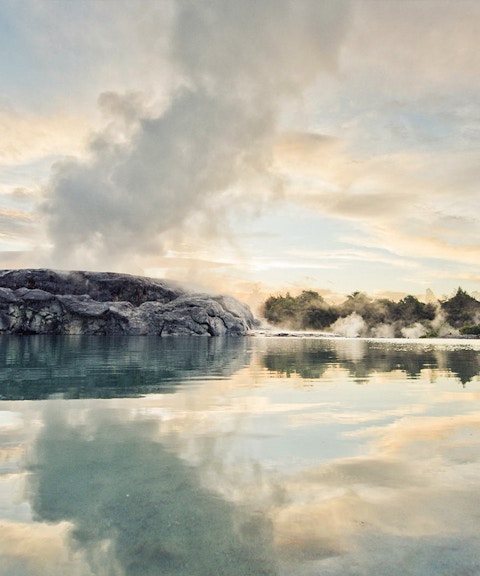 Geothermal steam rising from Te Puia's Pohutu Geyser in Rotorua, New Zealand.