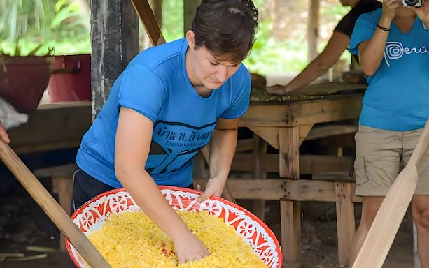 Person preparing food for elephants at ElephantsWorld Kanchanaburi.