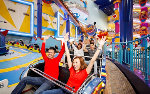Visitors enjoying a roller coaster ride at Berjaya Times Square Theme Park, Kuala Lumpur.