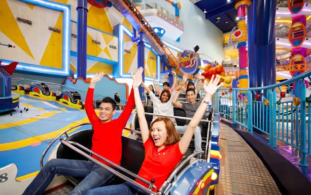 Visitors enjoying a roller coaster ride at Berjaya Times Square Theme Park, Kuala Lumpur.