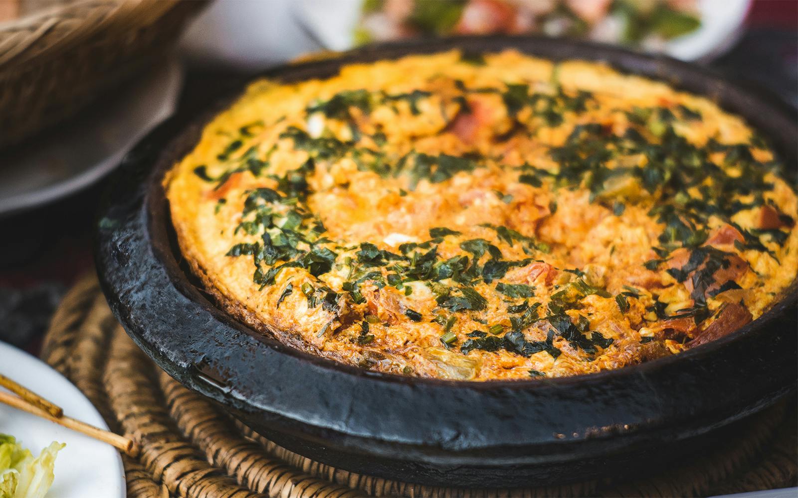 Berber omelette in a traditional clay pot, Morocco.