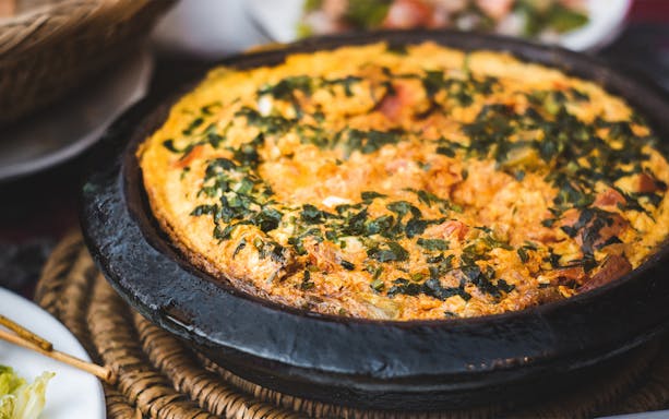 Berber omelette in a traditional clay pot, Morocco.