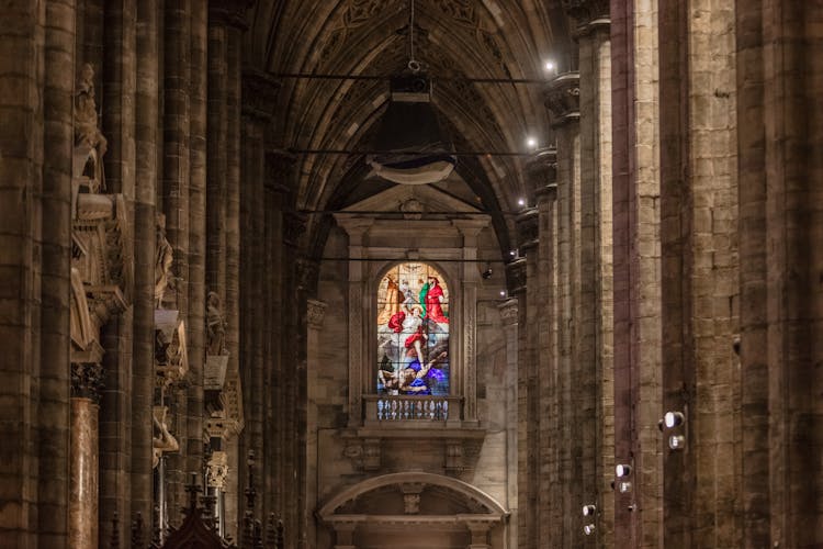 Stained glass window inside Milan Duomo Cathedral, Italy.