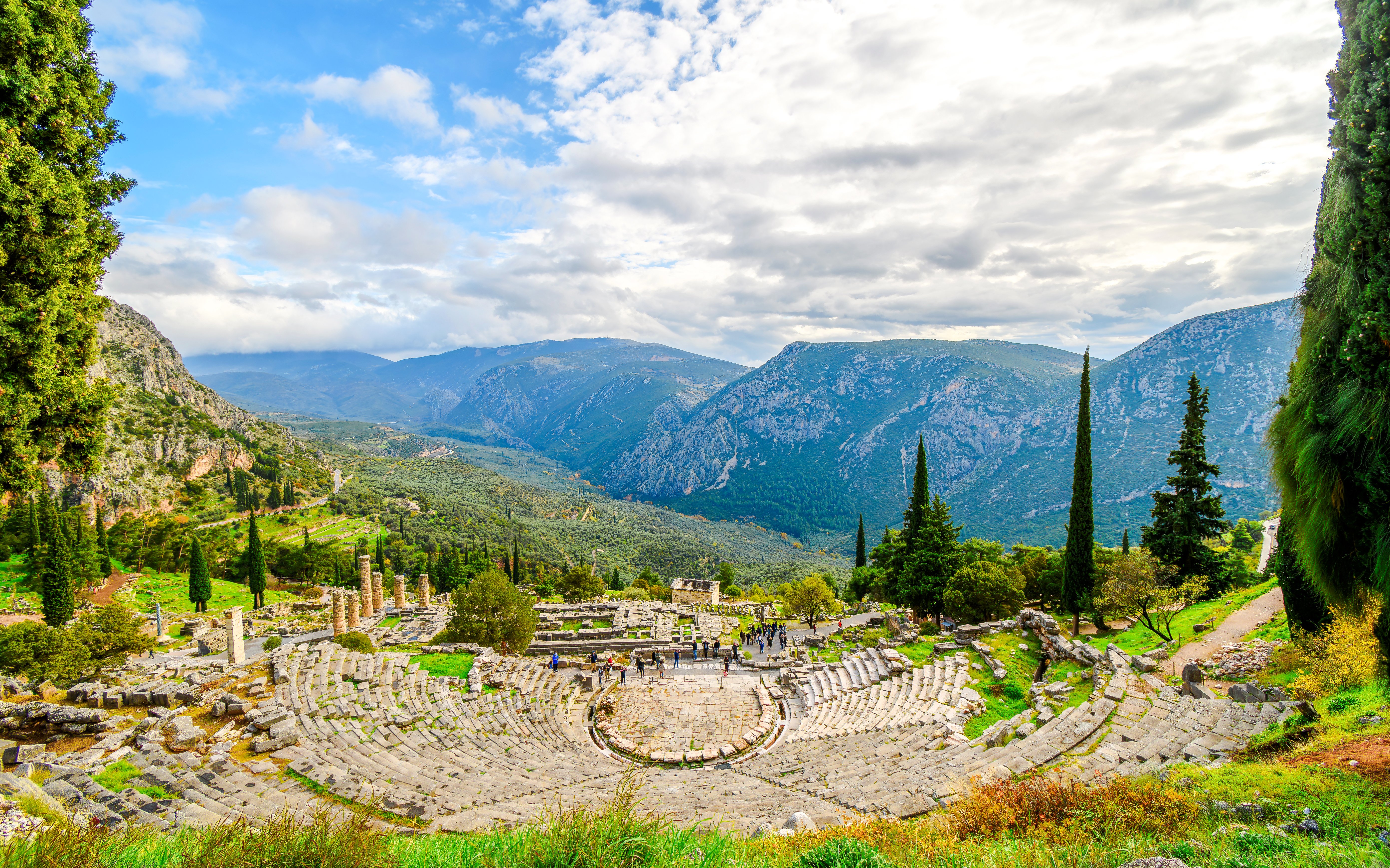 Theater of Delphi with mountainous backdrop in Greece.
