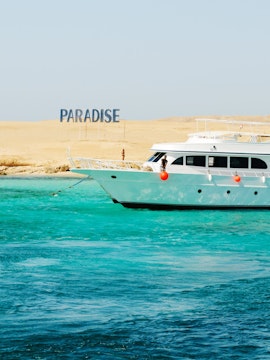 Cruise boat near Giftun Island, Hurghada with clear turquoise water.