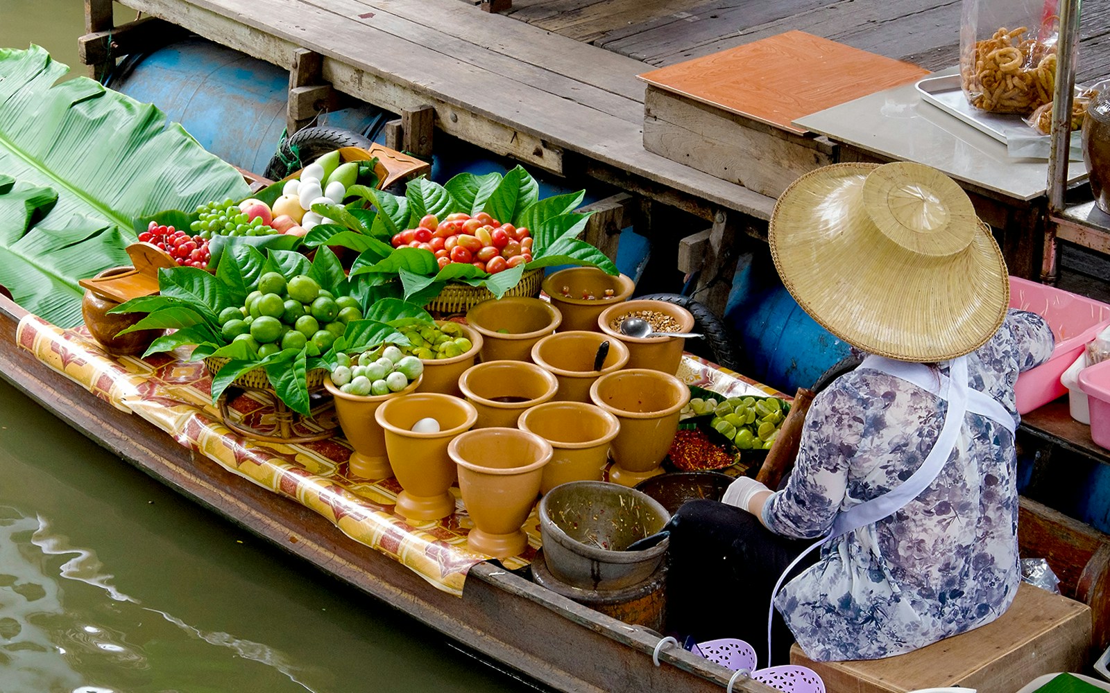 Traditional merchant in Taling Chan floating market, Thailand